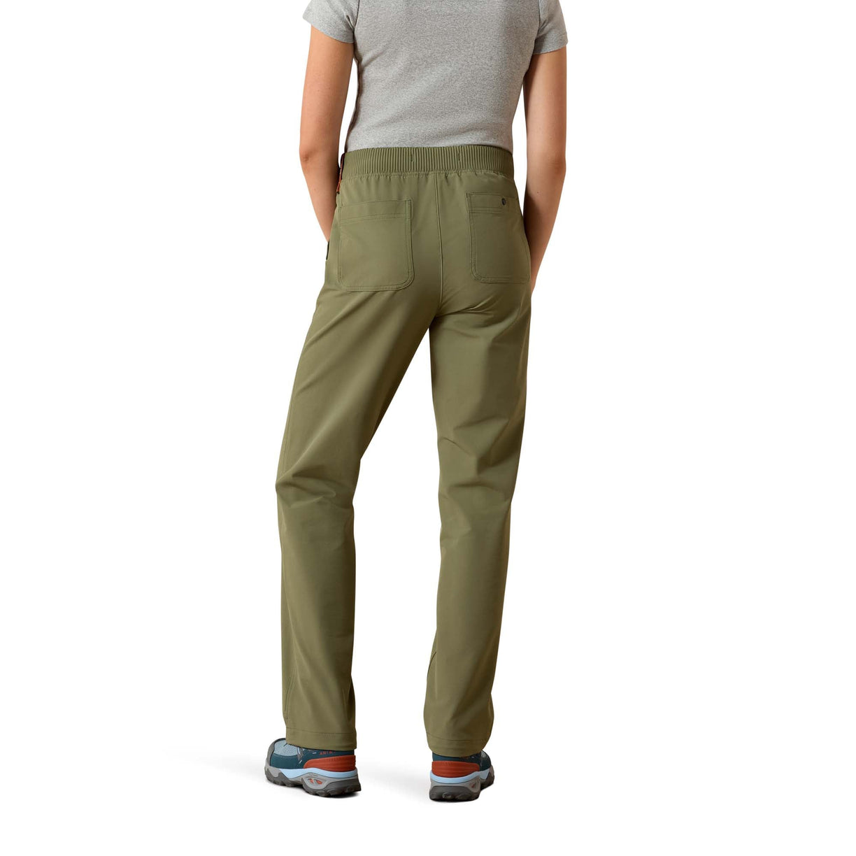 Person wearing olive green pants on a white background