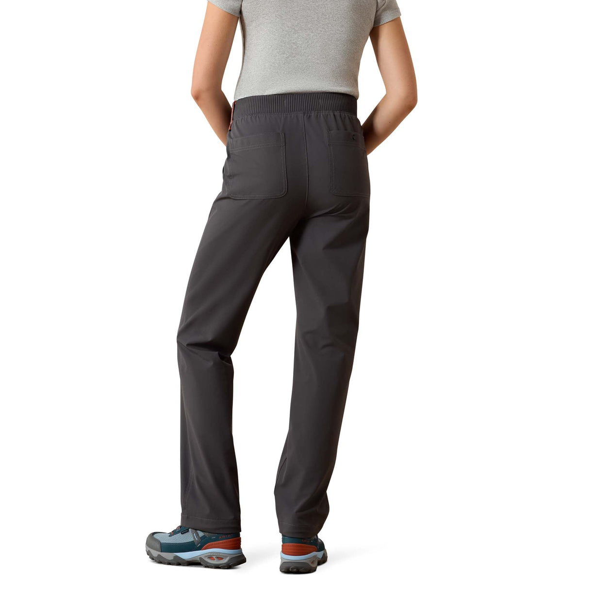 Person wearing dark gray pants on a white background