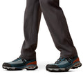 Close-up of hiking shoes with gray, blue, and orange design on a white background