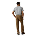 Man wearing brown pants and a gray shirt on a white background