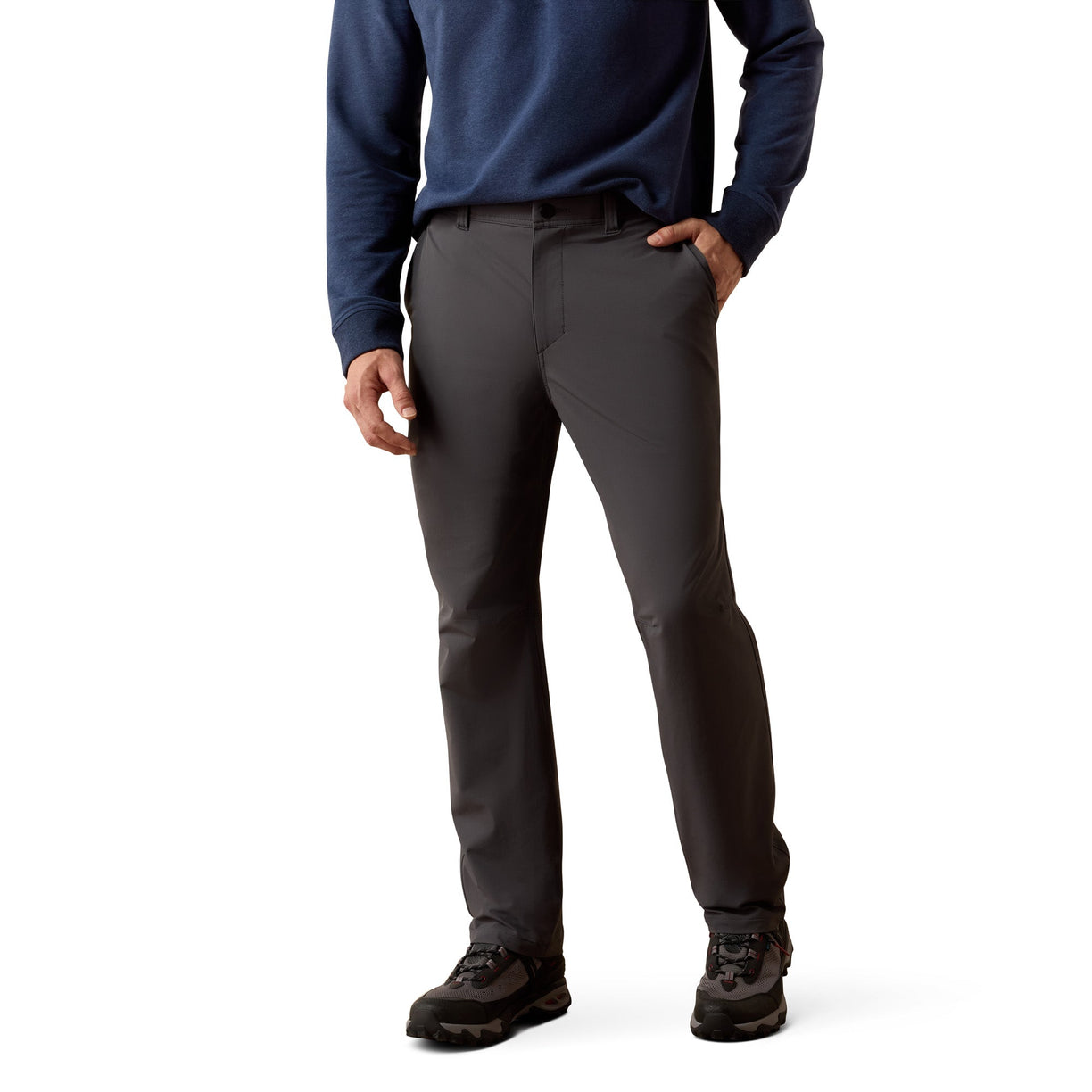 Person wearing dark gray pants and a blue long-sleeve shirt on a white background