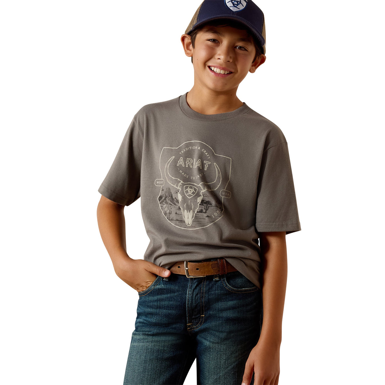 Child wearing a grey t-shirt with a logo and blue jeans