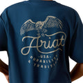 Boy wearing navy blue t-shirt with an eagle graphic and 'Ariat' branding