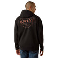 Person wearing a black hoodie with Ariat branding on the back, standing against a white background