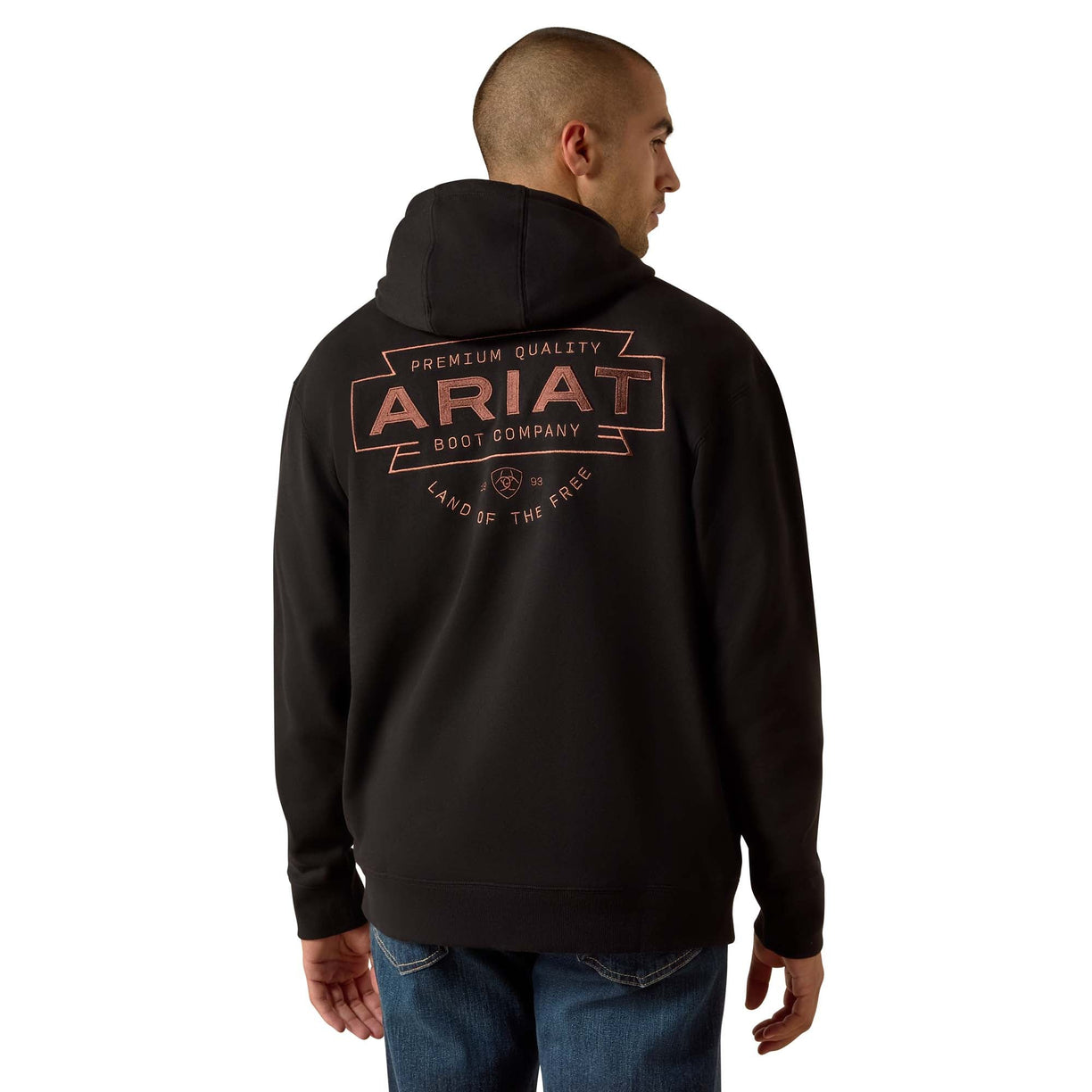 Person wearing a black hoodie with Ariat branding on the back, standing against a white background
