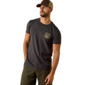 Man wearing a dark gray t-shirt with a logo and green pants on a white background