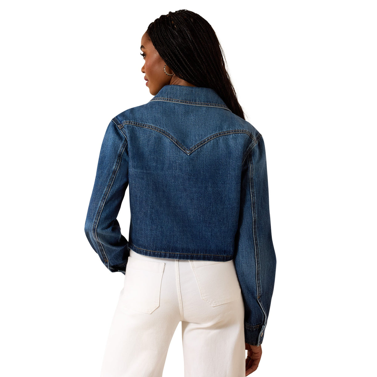 Person wearing a blue denim jacket on a white background