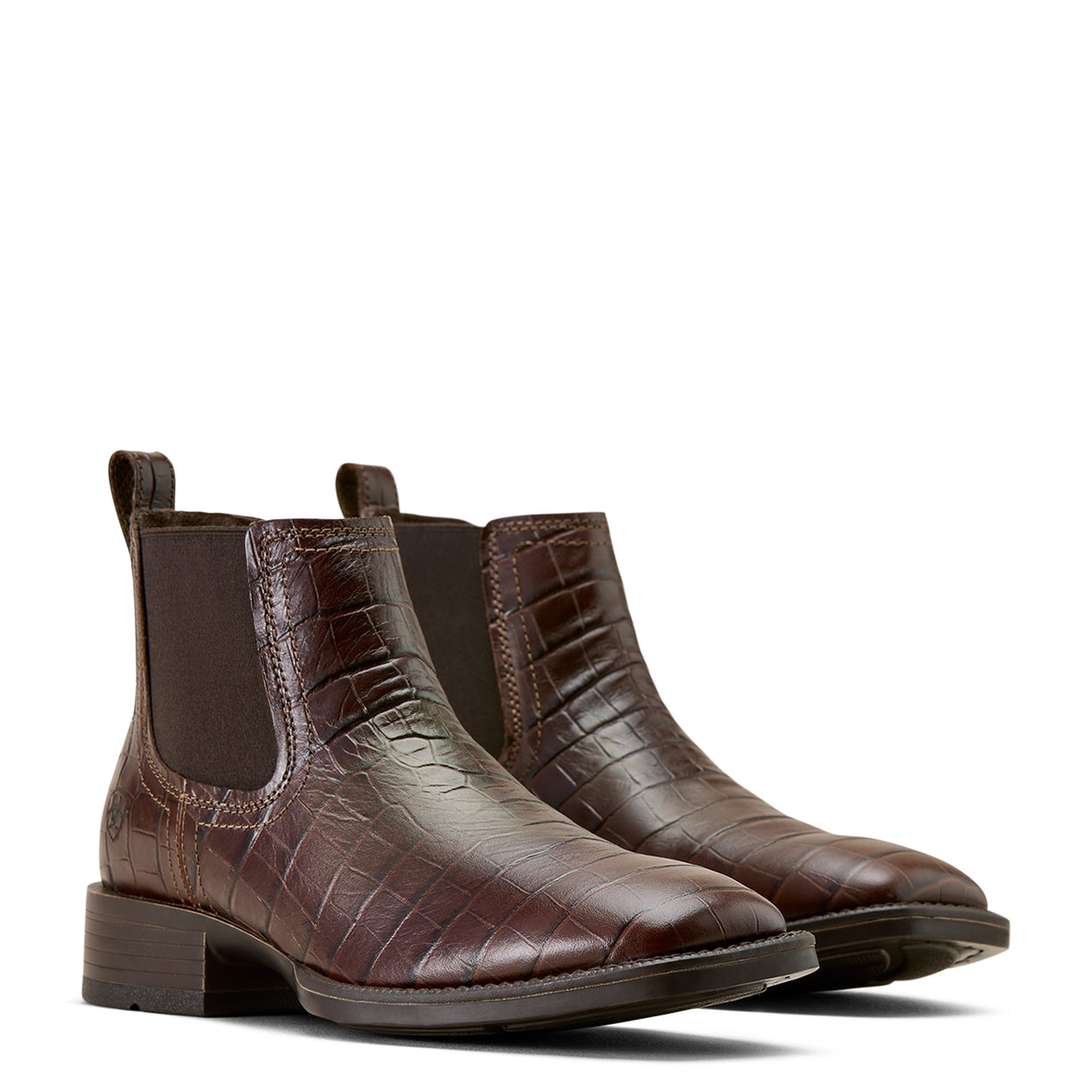 Pair of brown leather boots with a textured pattern on a white background