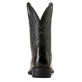 Black cowboy boot with intricate design on a white background