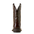 Brown cowboy boot with intricate design on a white background