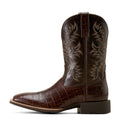 Brown cowboy boot with intricate design on a white background