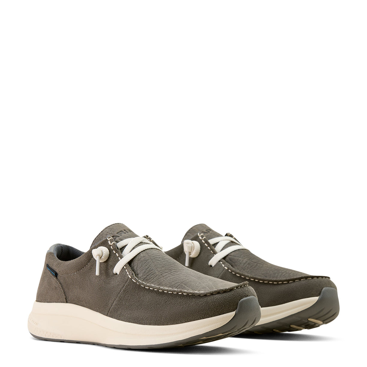 Pair of gray casual shoes with white soles on a white background