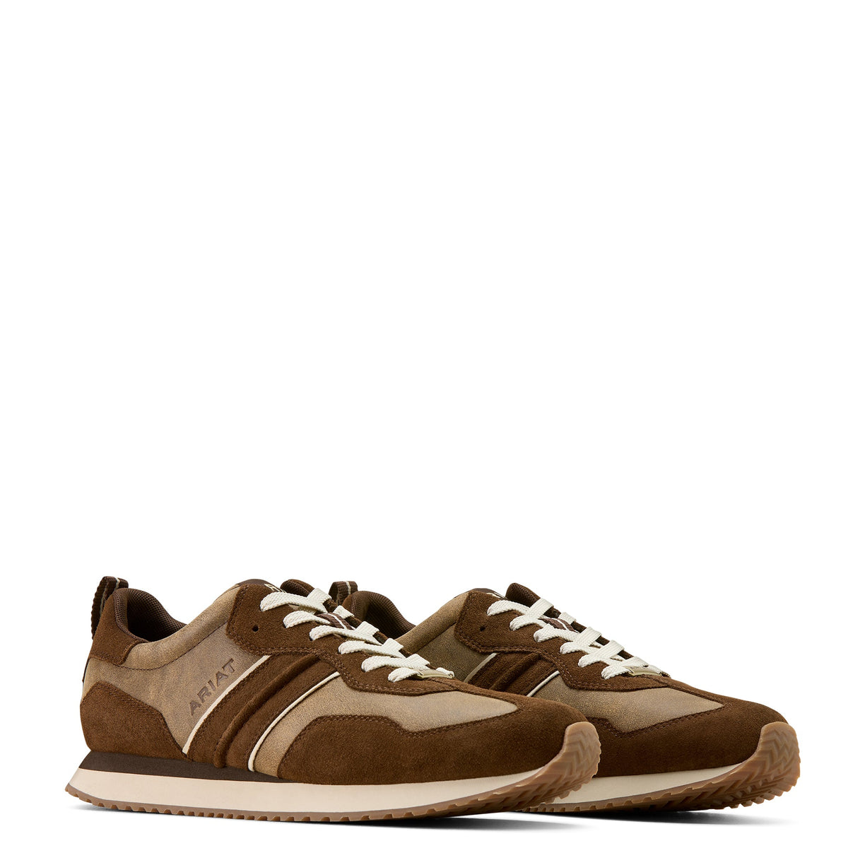 Pair of brown and beige sneakers on a white background