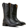 Pair of black leather cowboy boots on a white background