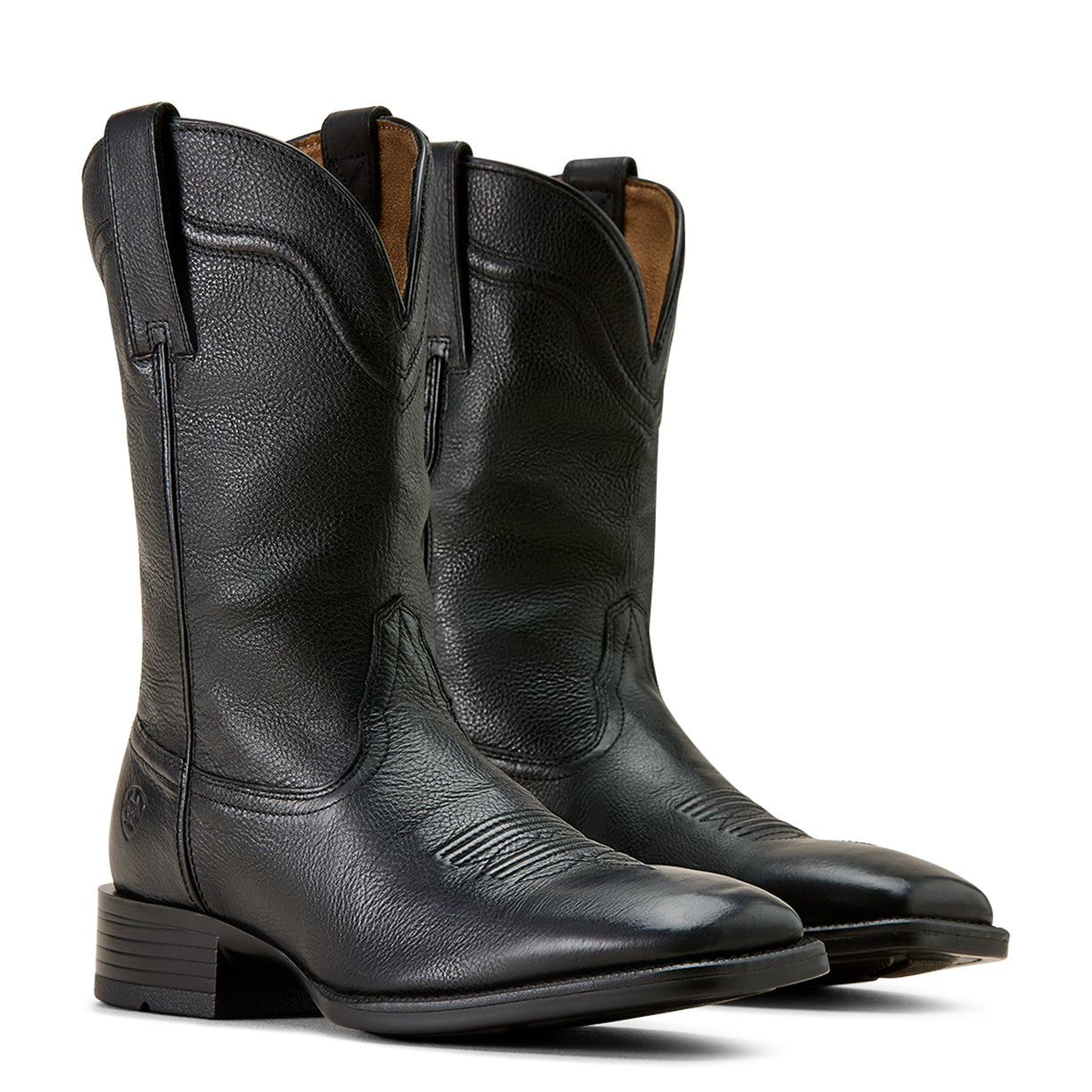 Pair of black leather cowboy boots on a white background