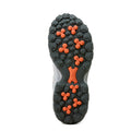 Close-up of a shoe sole with orange and black pattern on a white background