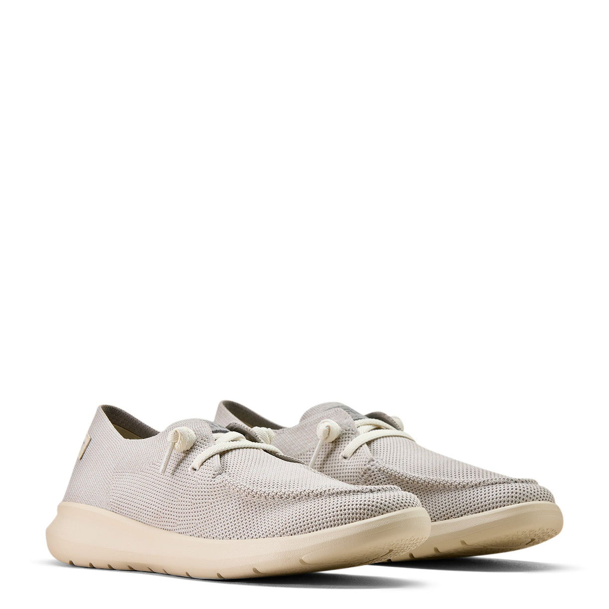 Pair of light gray sneakers on a white background
