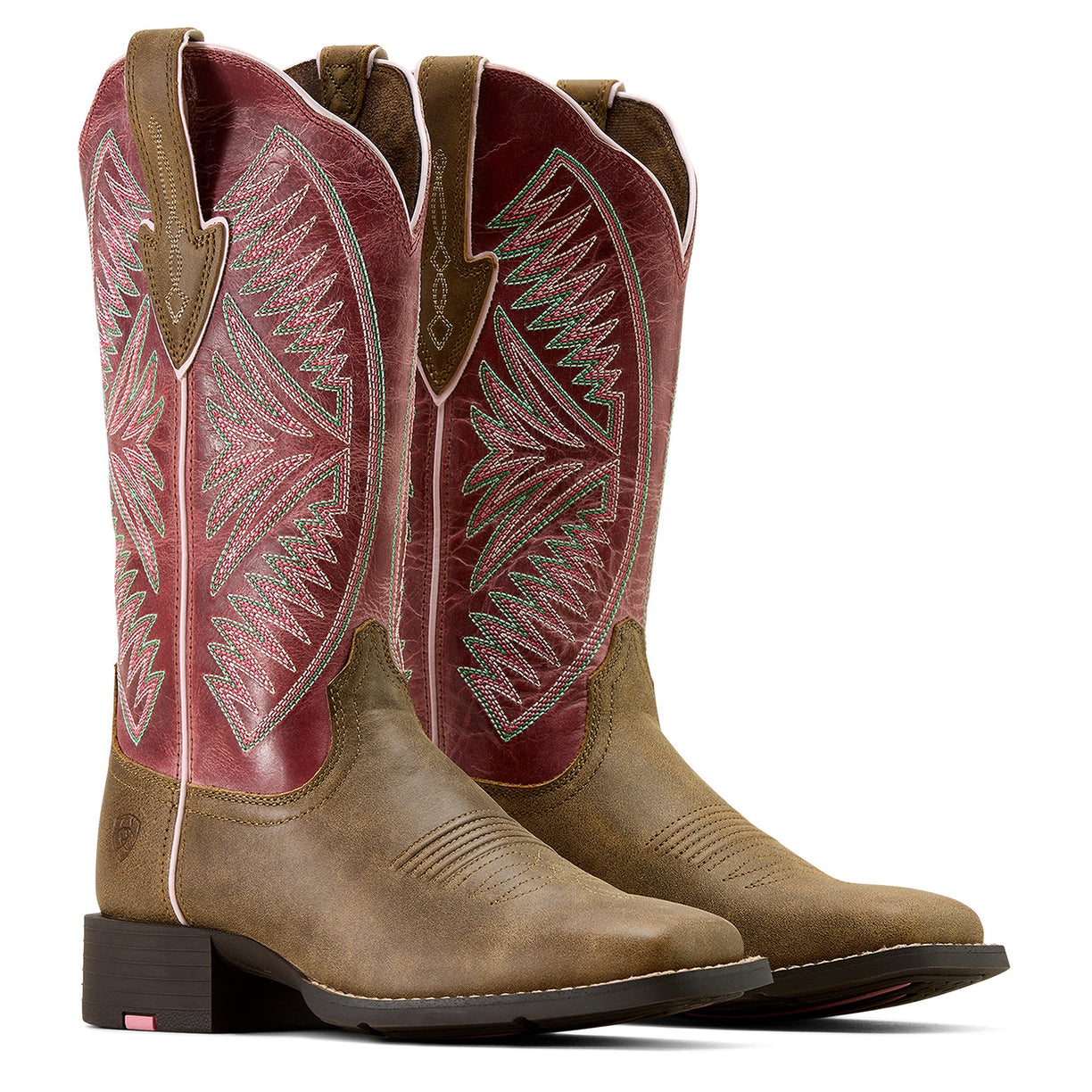 Pair of brown and red cowboy boots with intricate designs on a white background