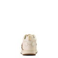 White sneaker with brown sole on a white background