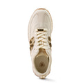 Beige sneaker with brown accents on a white background