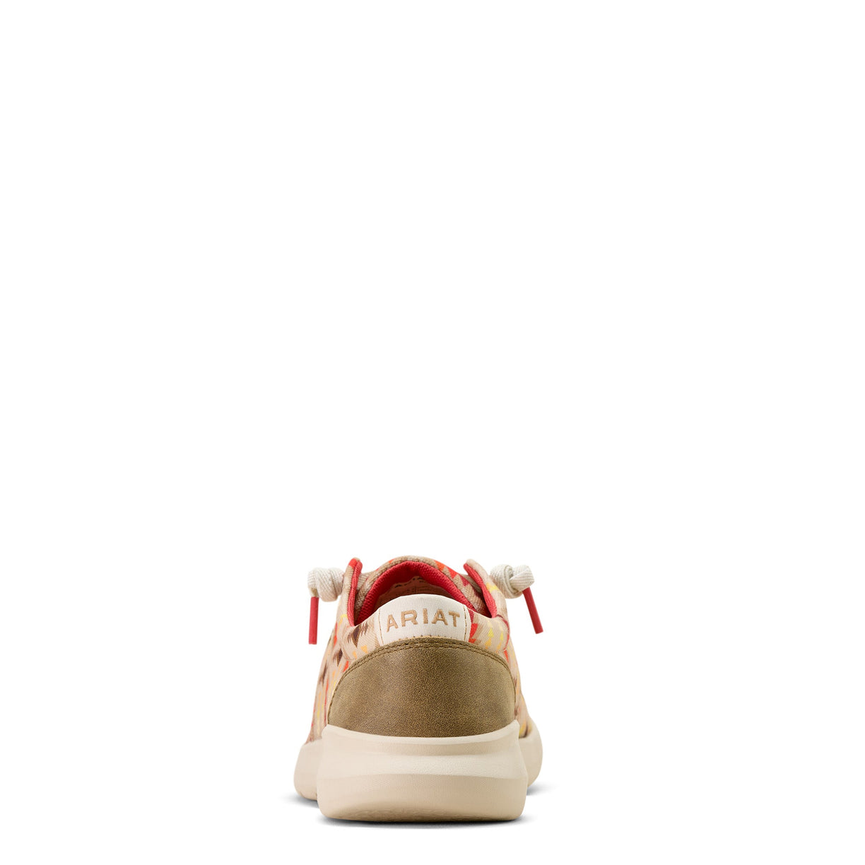 Tan sneaker with red accents on a white background