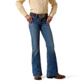 Person wearing blue Ariat trouser jeans and a beige shirt on a white background