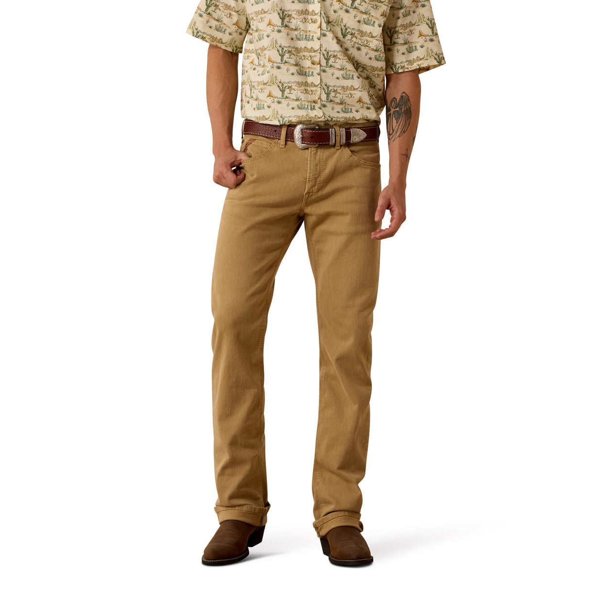 Man wearing a patterned shirt and beige denim jeans on a white background