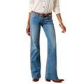 Person wearing blue Ariat trouser jeans with a white dress shirt on a white background