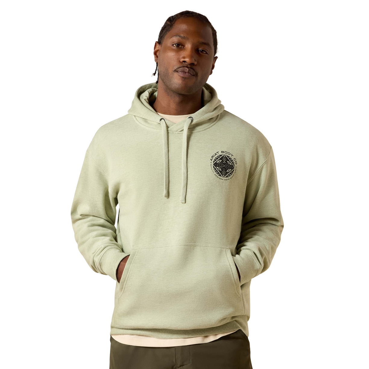 Man wearing a beige hoodie with a logo on a white background