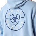 Light blue hoodie with Ariat Boot Co logo on a person wearing it