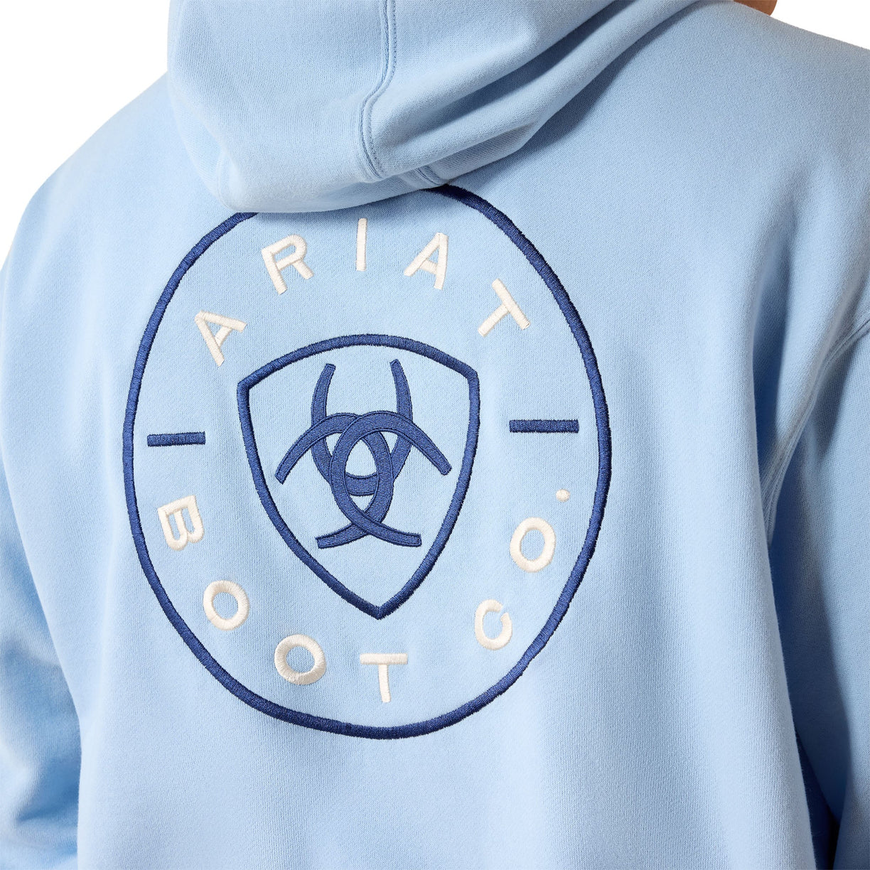 Light blue hoodie with Ariat Boot Co logo on a person wearing it