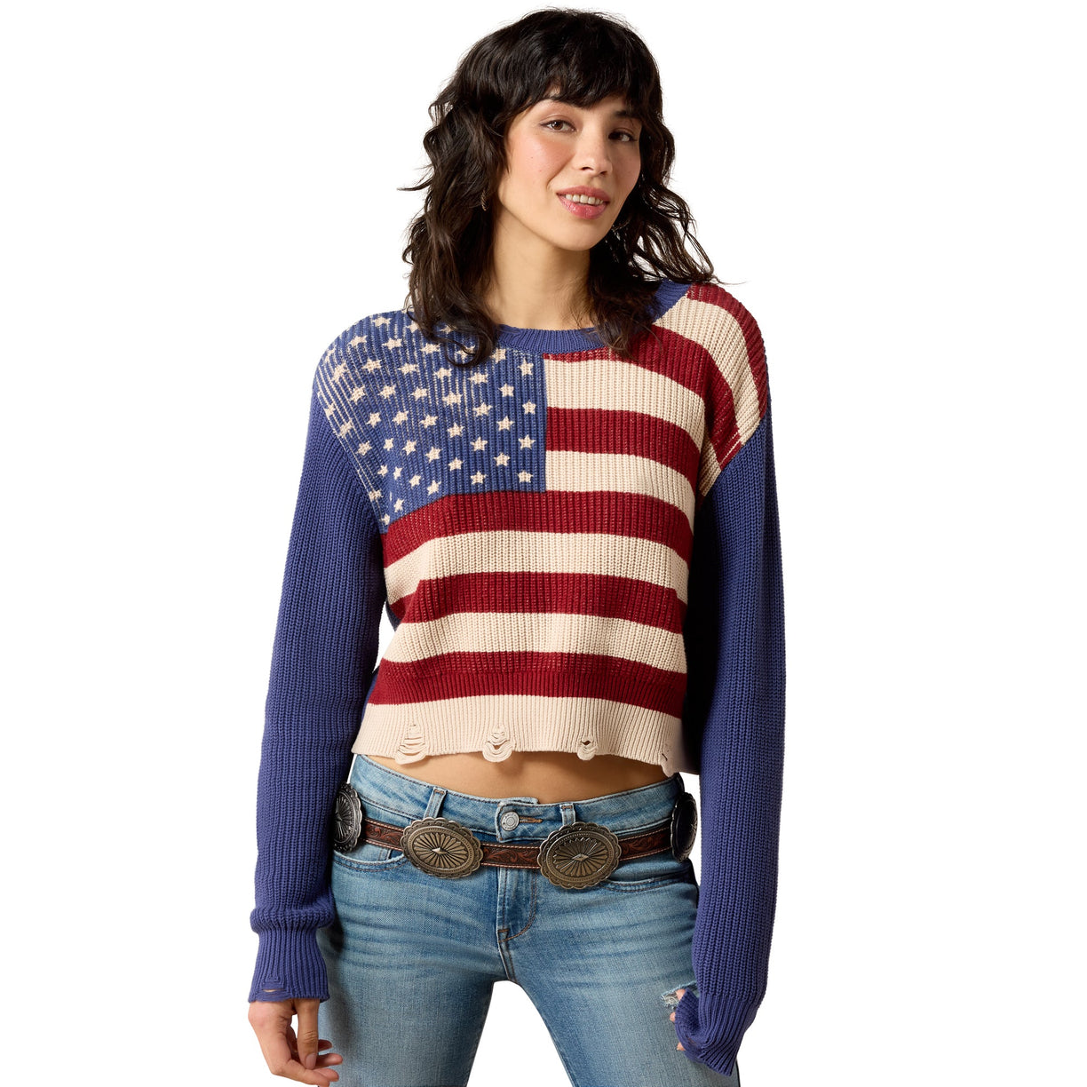 Woman wearing a sweater with an American flag design on a white background