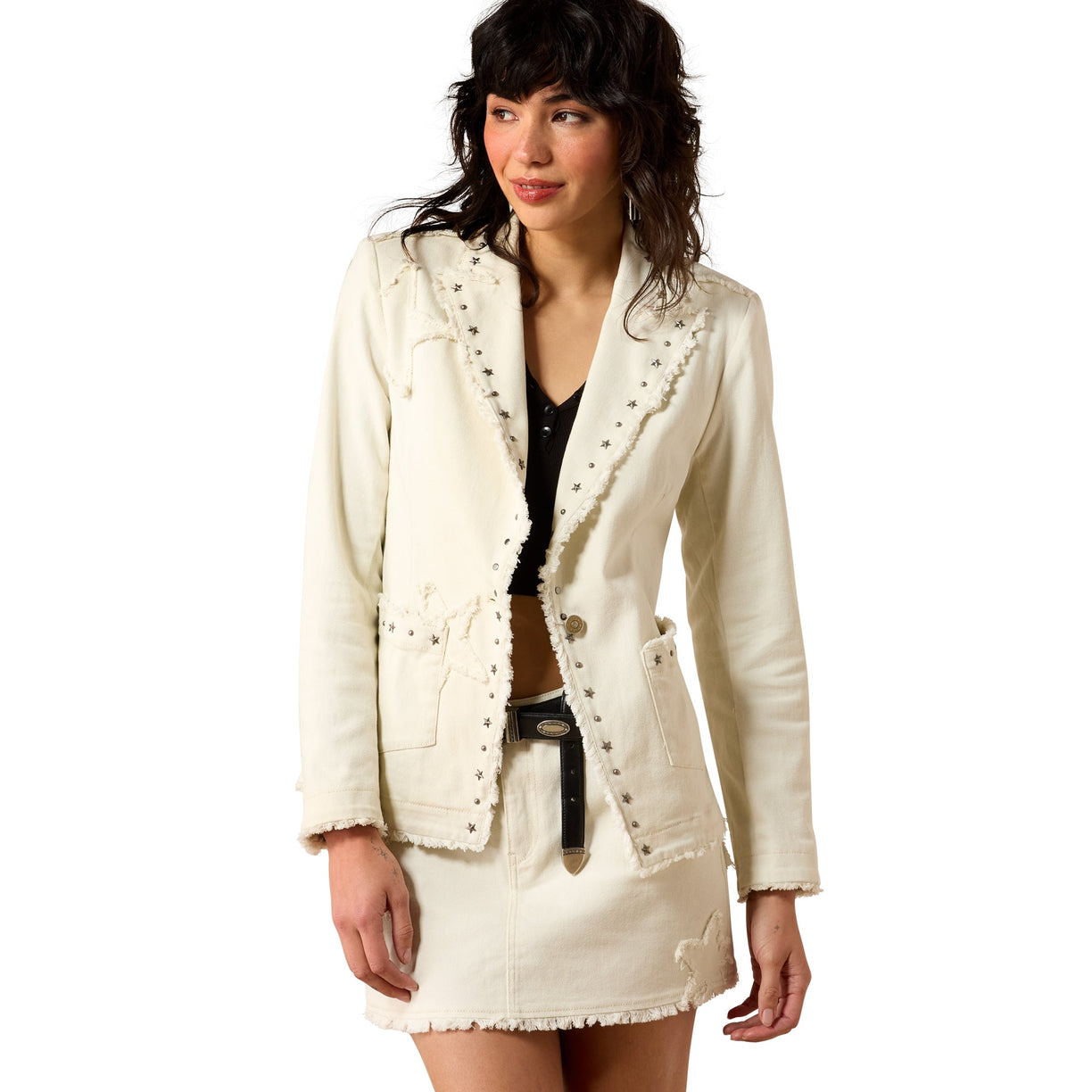 Woman wearing a white jacket with decorative buttons on a white background