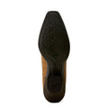 Brown suede shoe sole with black tread pattern on a white background
