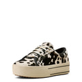 Black and white cow print sneaker on a white background