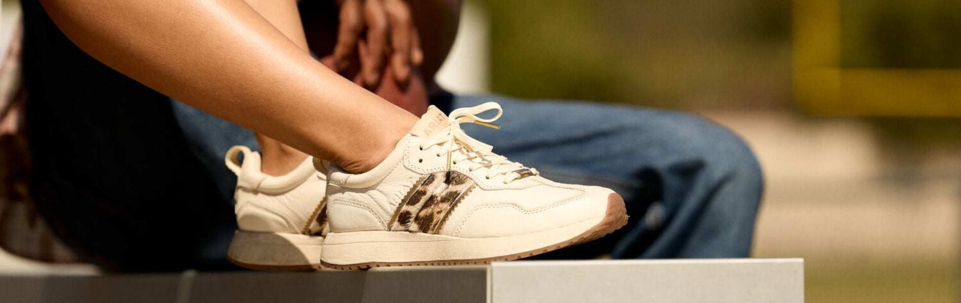 Ariat Ranch Runner - New Casual Footwear with a nostalgic, cool vibe worn by female model close up on shoes.