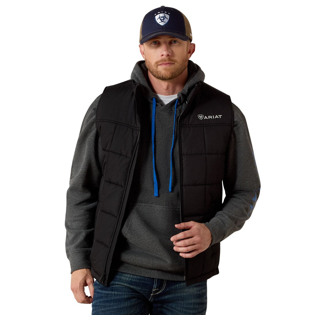 Man wearing a black jacket with a visible brand logo on a white background