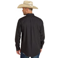 Man wearing a black long-sleeve shirt and beige cowboy hat on a white background