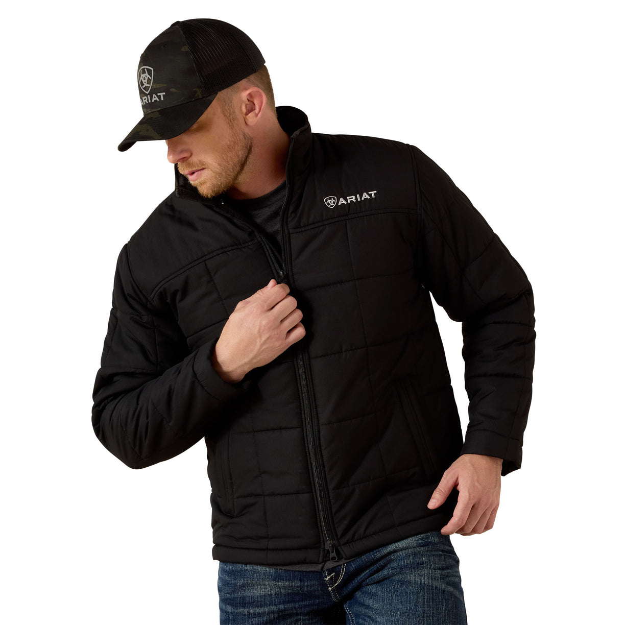 Man wearing a black jacket and cap with Ariat logo on a white background