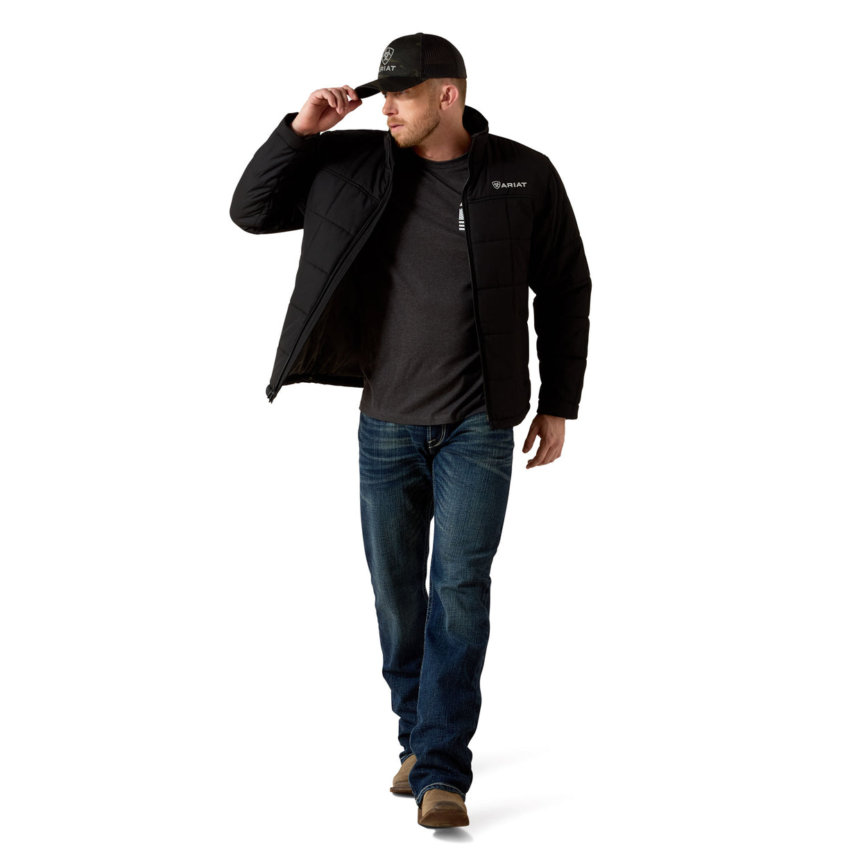 Man wearing a black jacket and cap on a white background