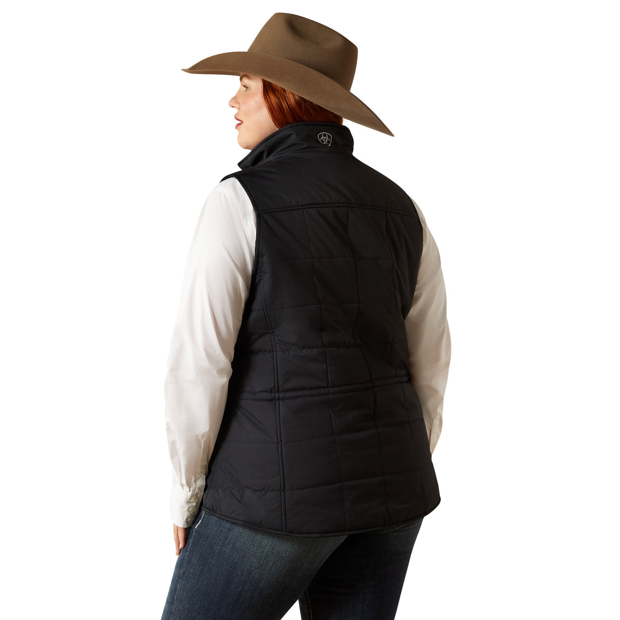 Person wearing a black vest and brown cowboy hat on a white background