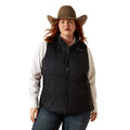 Person wearing a black puffer vest, white shirt, blue jeans, and brown cowboy hat on a white background