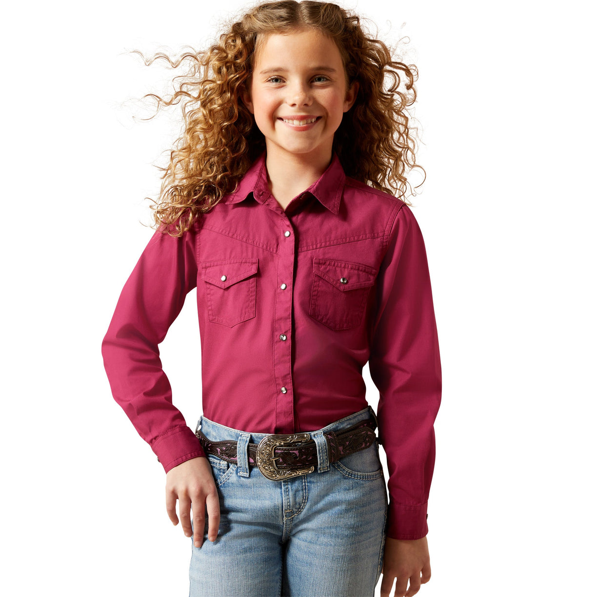 Young girl wearing a pink shirt and blue jeans on a white background