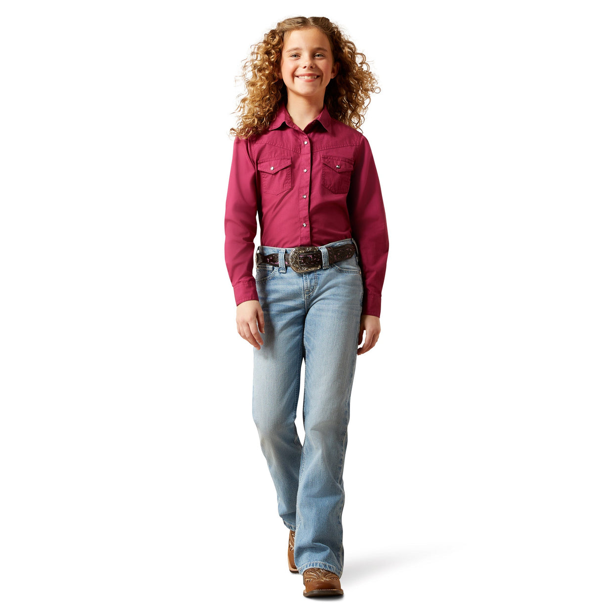 Child wearing a red shirt and blue jeans on a white background