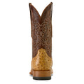 Brown cowboy boot with intricate design on a beige background