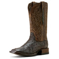 Brown cowboy boot with intricate embossing on a white background
