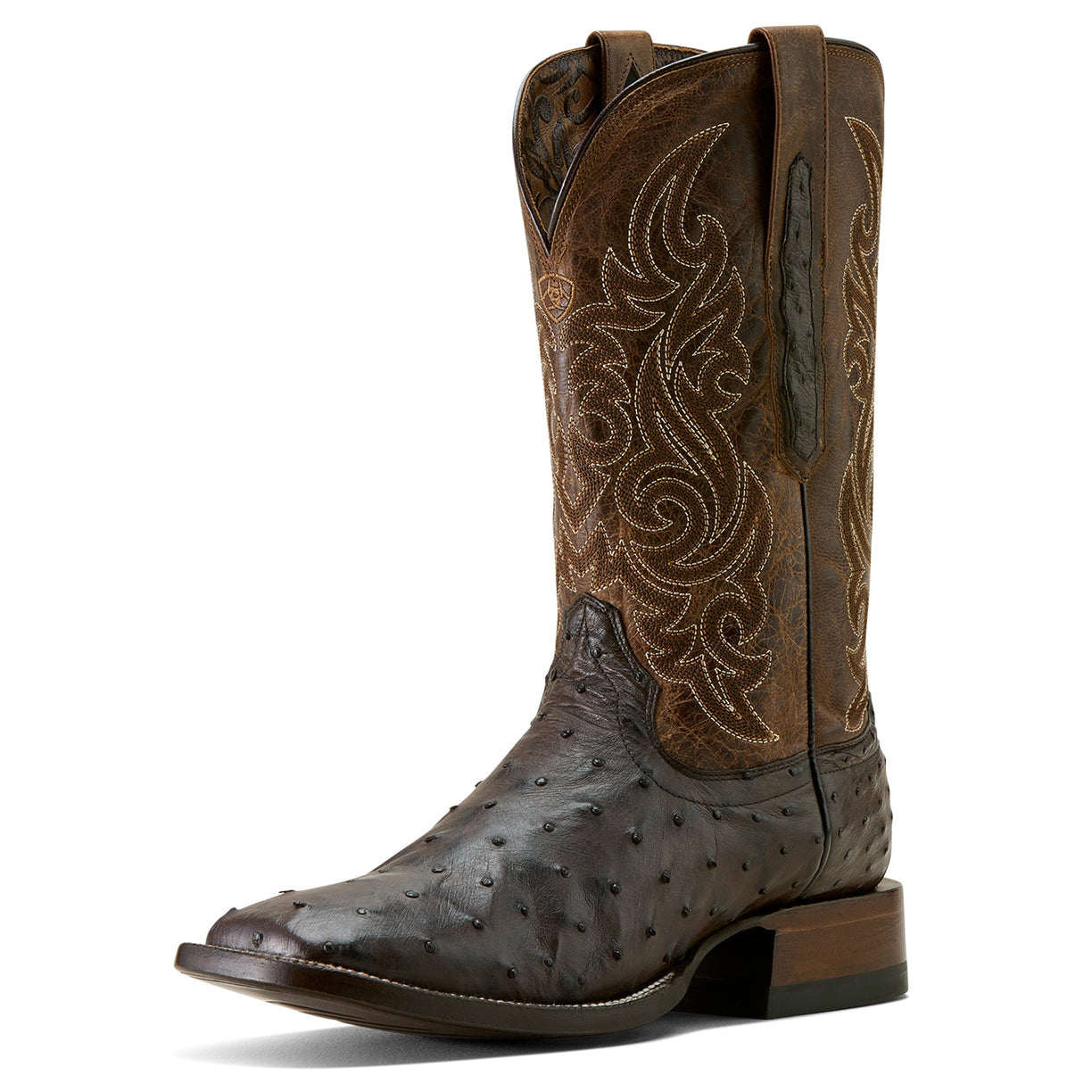 Brown cowboy boot with intricate embossing on a white background