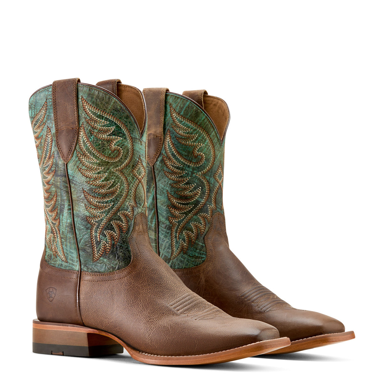 Pair of brown and green cowboy boots with intricate designs on a white background