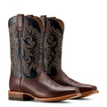 Pair of brown cowboy boots with intricate designs on a white background