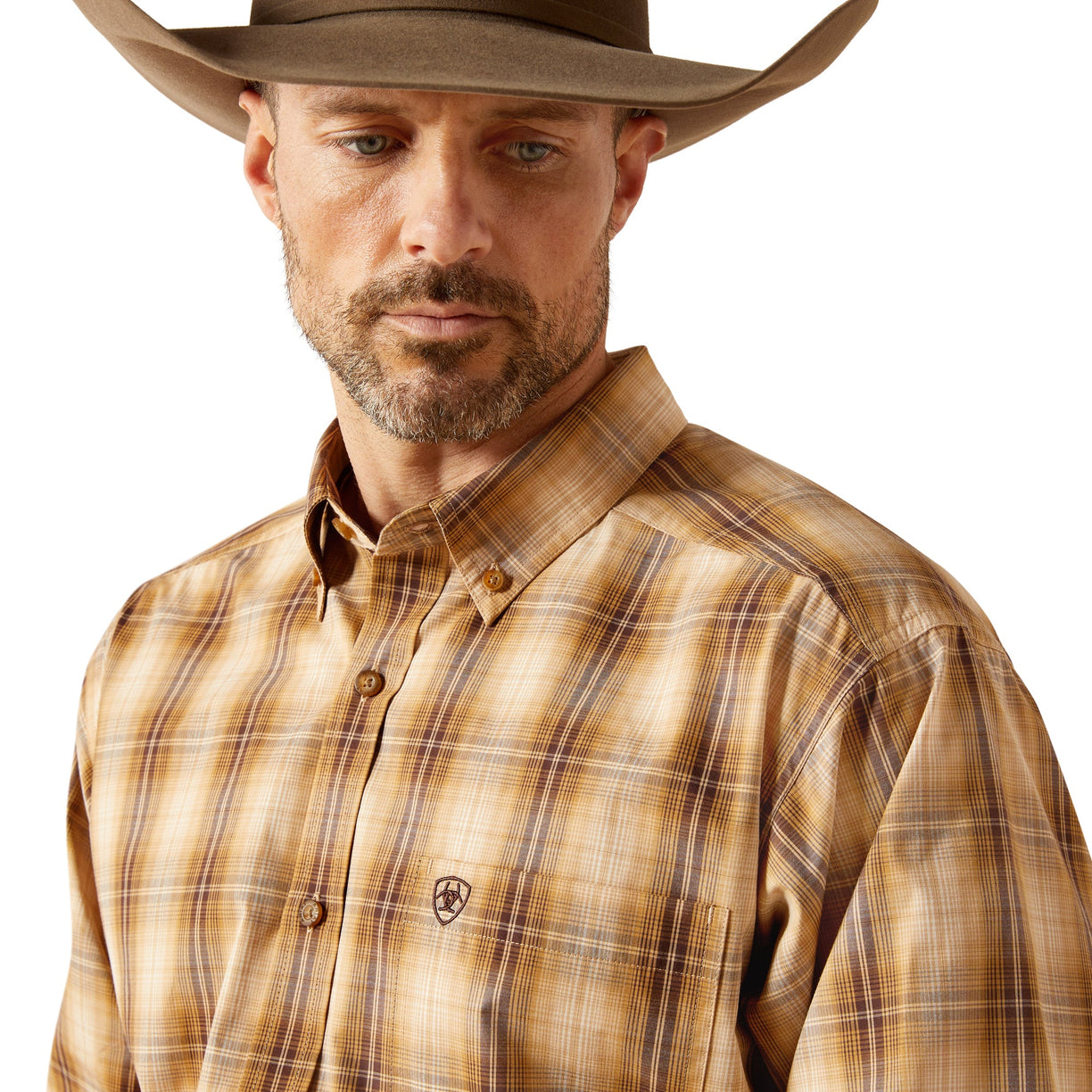 Man wearing a brown plaid shirt and cowboy hat on a white background